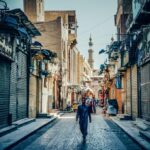 A guy walking the streets of Islamic Cairo by Alejandro Garcia via Unsplash
